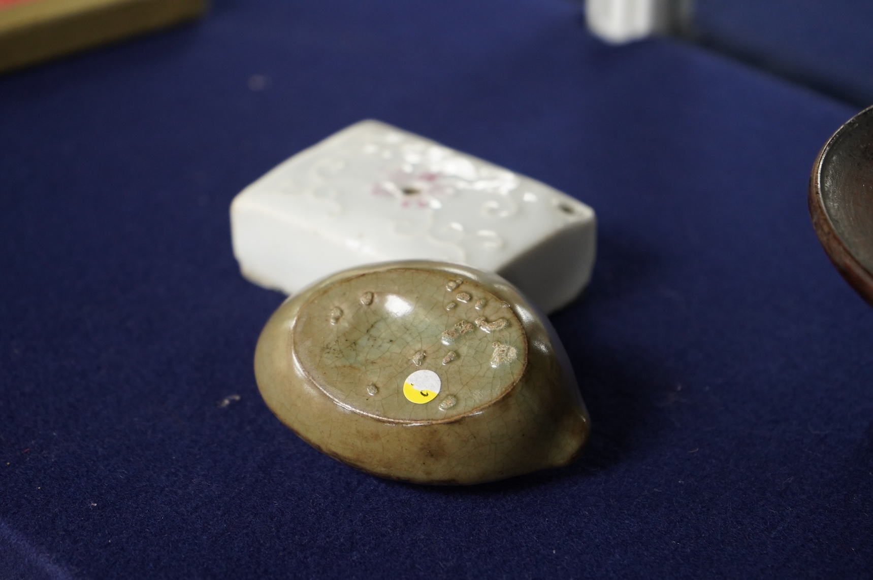 Two 19th century Korean ceramic water droppers and a Korean turned wood cup stand, oval water dropper 8cm long